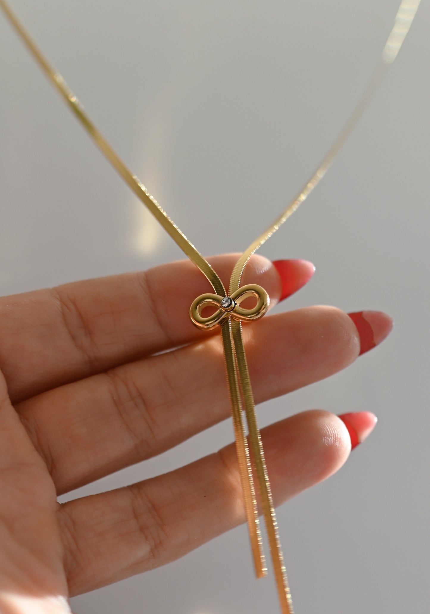 COLLAR LAZO INFINITO CON BAÑO DE ORO SOBRE ACERO INOXIDABLE 316L