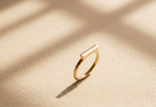 ANILLO ESSENTIAL EN ACERO CON ACABADO DORADO POLISHED