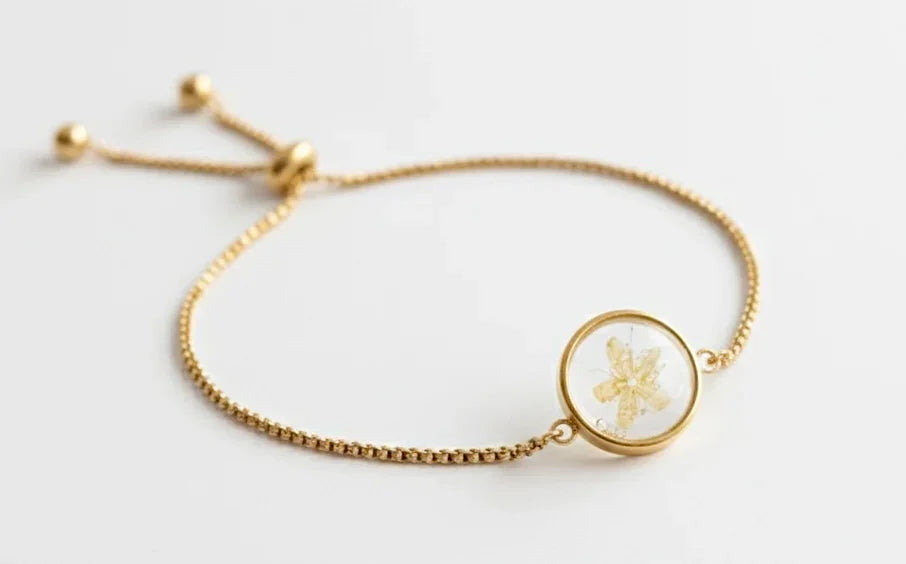 PULSERA AJUSTABLE SUSURRO DORADO EN ACERO INOX. CON BAÑO DE ORO 18 KT
