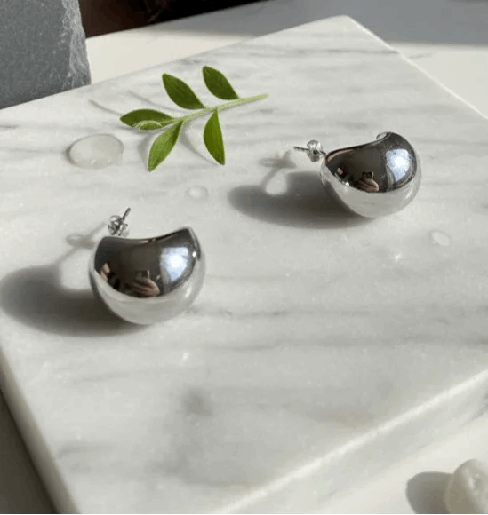 PENDIENTES MEDIA LUNA EN ACERO INOXIDABLE 316L CON ACABADO BRILLANTE - COLOR PLATA