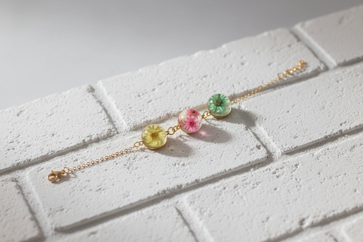 PULSERA TRICOLOR JARDÍN CON TRES ESFERAS BOTÁNICAS Y BAÑO DE ORO 18 KT