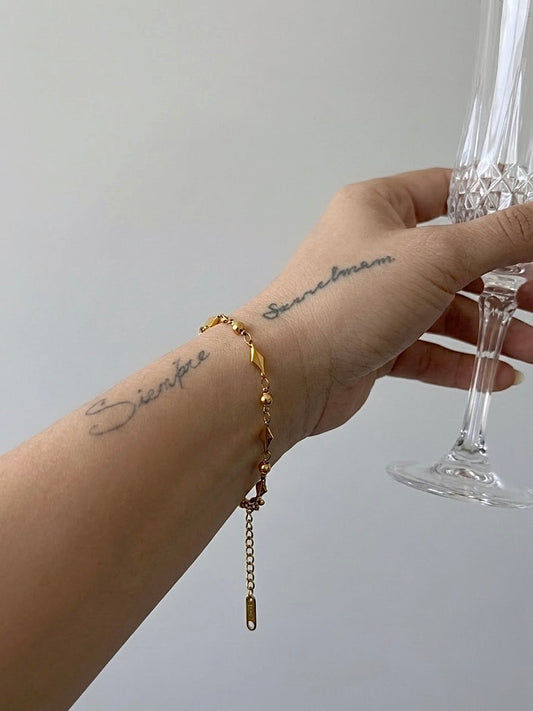 PULSERA CON ESLABONES DE ARROZ DORADA