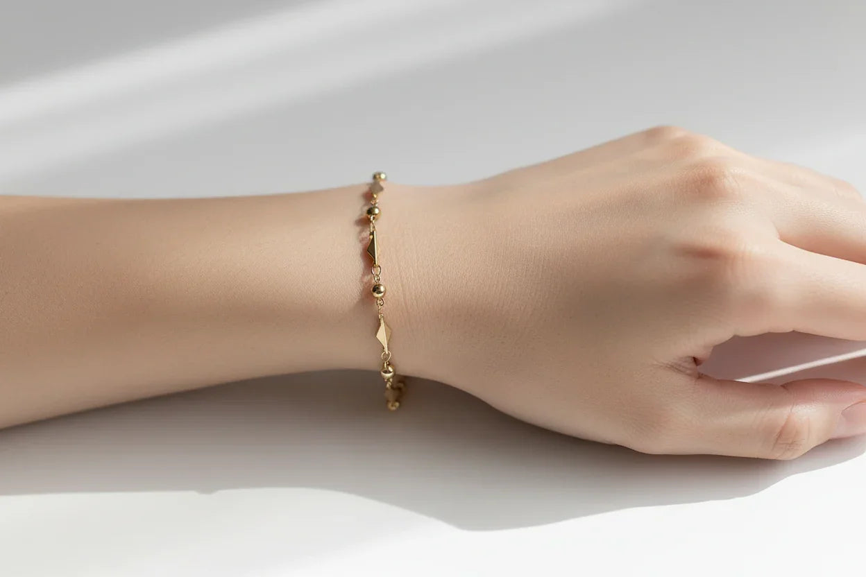 PULSERA CON ESLABONES DE ARROZ DORADA